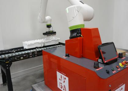 Encaissage cobot de barquettes en inox et carton